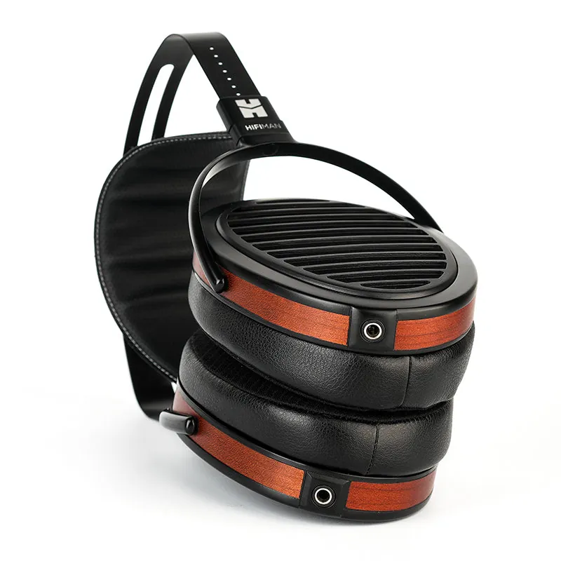 HiFiMan Arya Organic headphones with wooden rings, folded three-quarter view